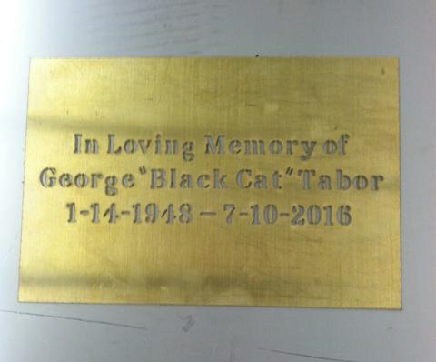 Plaque cut from something gold/bronze looking